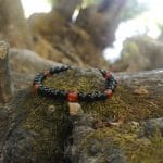 Elastyczna męska bransoletka z czarnego onyksu i pomarańczowego agatu na mchu