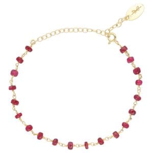 bransoletka damska srebrna pozłacana łancuszkowa z rubinem. Bransoletka posiada przedłużkę na której końcu zawieszona jest zawieszka z logo Rosett