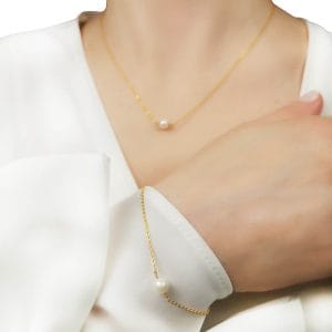 elegancki i delikatny damski naszyjnik srebrny pozłacany z perłą oraz bransoletka damska z perłą