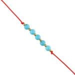 Bransoletka na czerwonym sznureczku z niebieskim kamieniem turkus