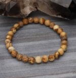 Elastyczna męska bransoletka z kamieniem brązowy jaspis na marmurze