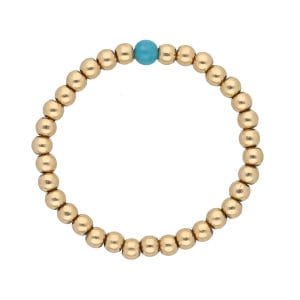 pierścionek elastyczny z kuleczek gold filled i z jedną kuleczką niebieskiego apatytu