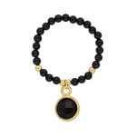 pierścionek srebrny pozłacany elastyczny z kuleczek onyksu i zawieszką z onyksem w okuciu srebrnym